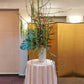 structural tropical flower arrangement for a bar