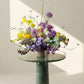 Colorful flower arrangement with lilac and yellow flowers are ready for a flower delivery in Colorado
