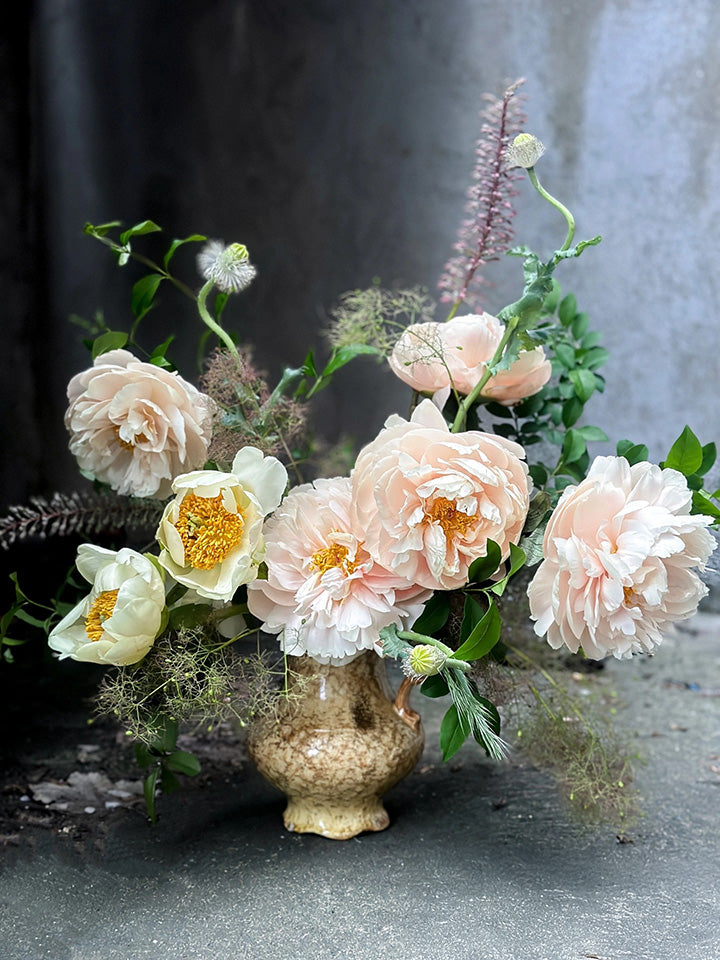 Shaa.Project medium flower arrangement subscription featuring a variety of colorful blooms in a stylish vase.