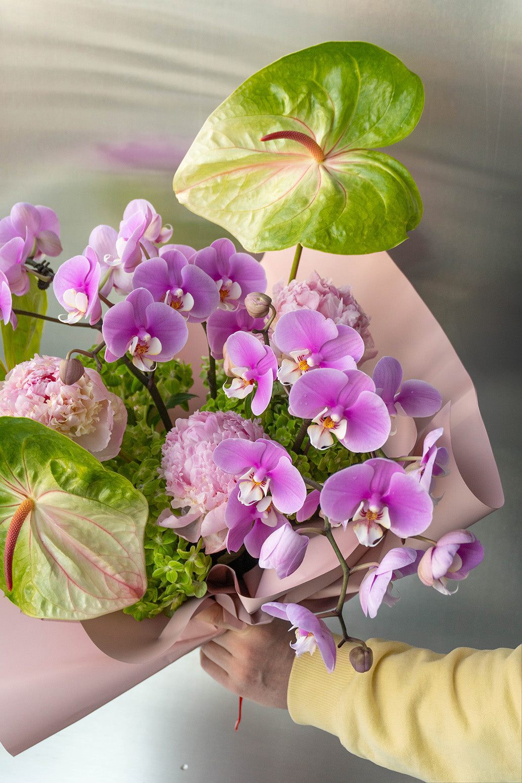 Valentine’s orchid and anthurium bouquet in blush wrap, Denver and Boulder delivery