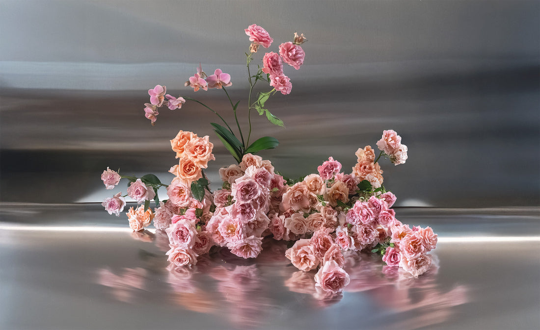 Pink garden roses arrangement on a reflective surface by Shaa.Project