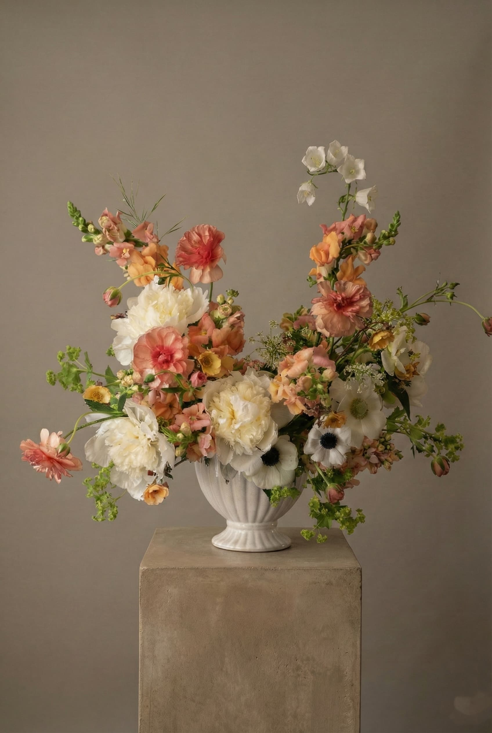 Apricot flower arrangement with peach blooms, peonies, snapdragons, and seasonal garden flowers