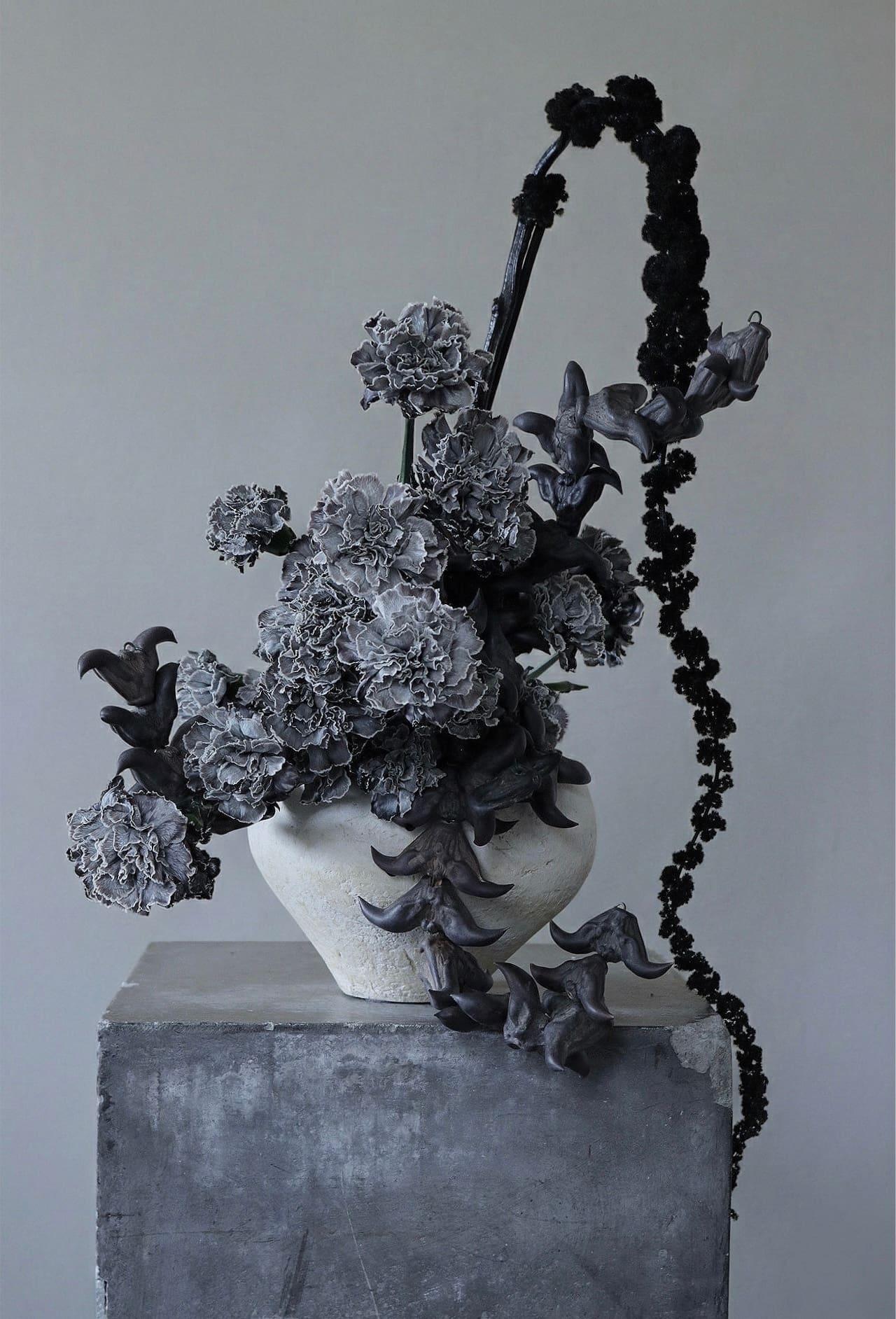 black and white floral sculpture made of carnation and amaranthus