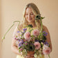 Curious Garden artistic flower arrangement with dahlias and sculptural stems