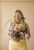 Curious Garden artistic flower arrangement with dahlias and sculptural stems