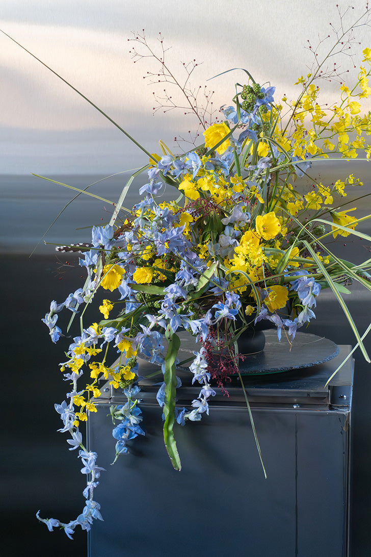 delphinium_garland with yellow orchids flower arrangement, designer Choice same-day flower delivery 