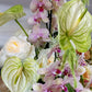 Fresh Reverie bouquet featuring orchids, roses, anthuriums, and amaranth by Shaa.Project in a vibrant arrangement.