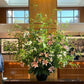 Shaa.Project small mono bloom flowers in a stylish arrangement for business subscription display.