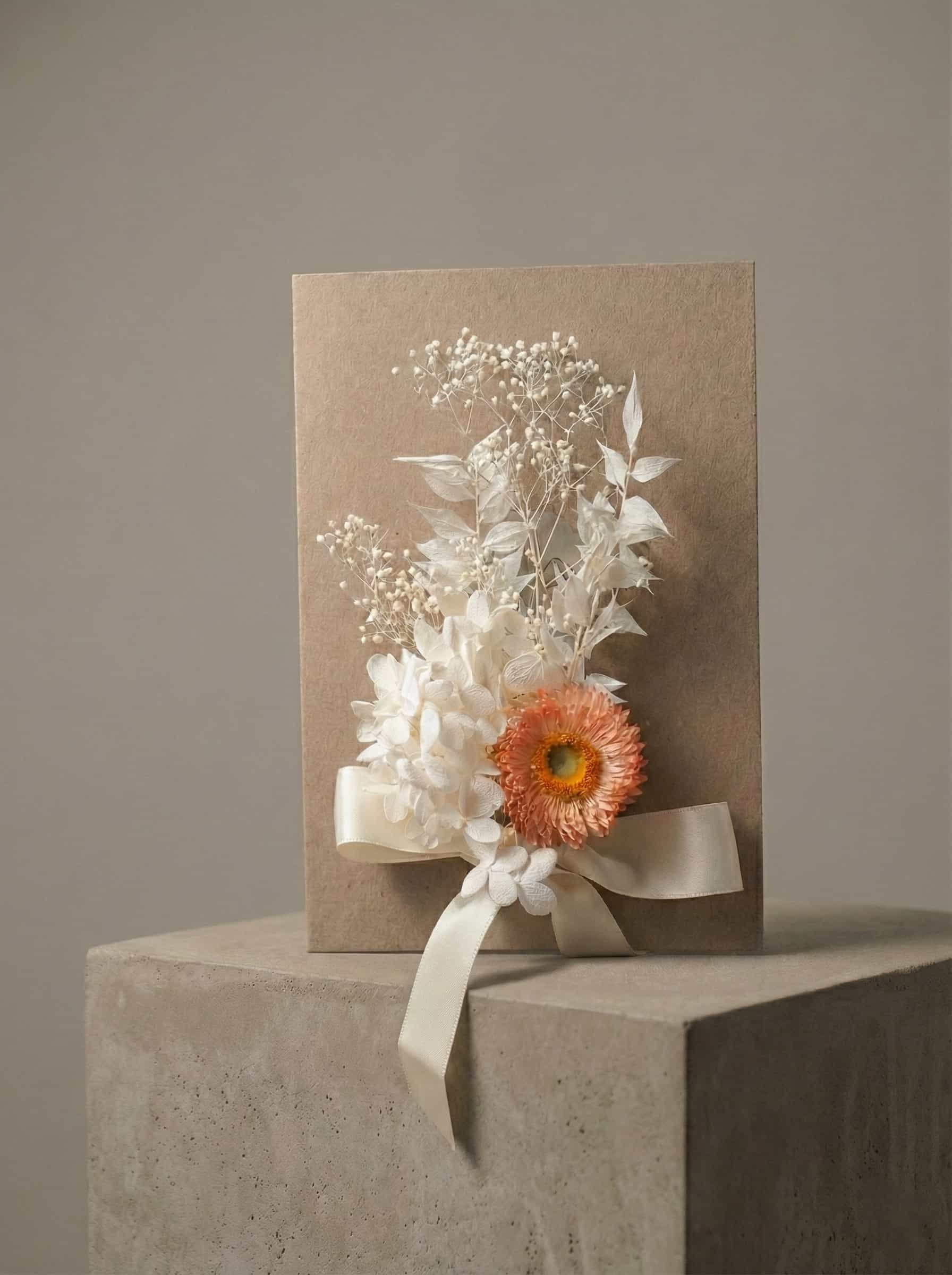 handmade message card with dried flowers and ribbon detail