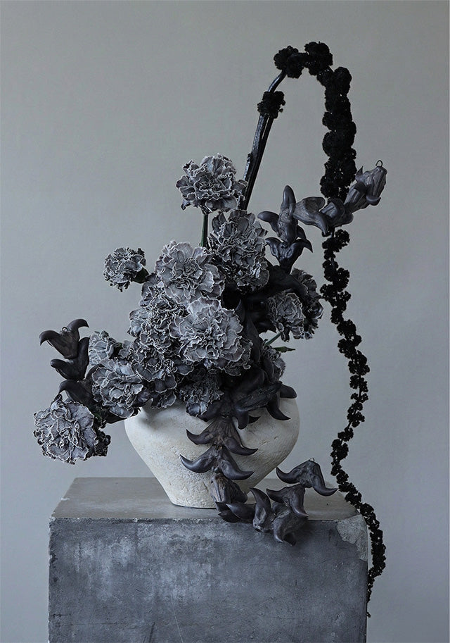Artistic arrangement of black and gray flowers, Colorado art and floral studio