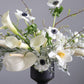 close-up of white sympathy flower arrangement with calla lilies and anemones by shaa.project