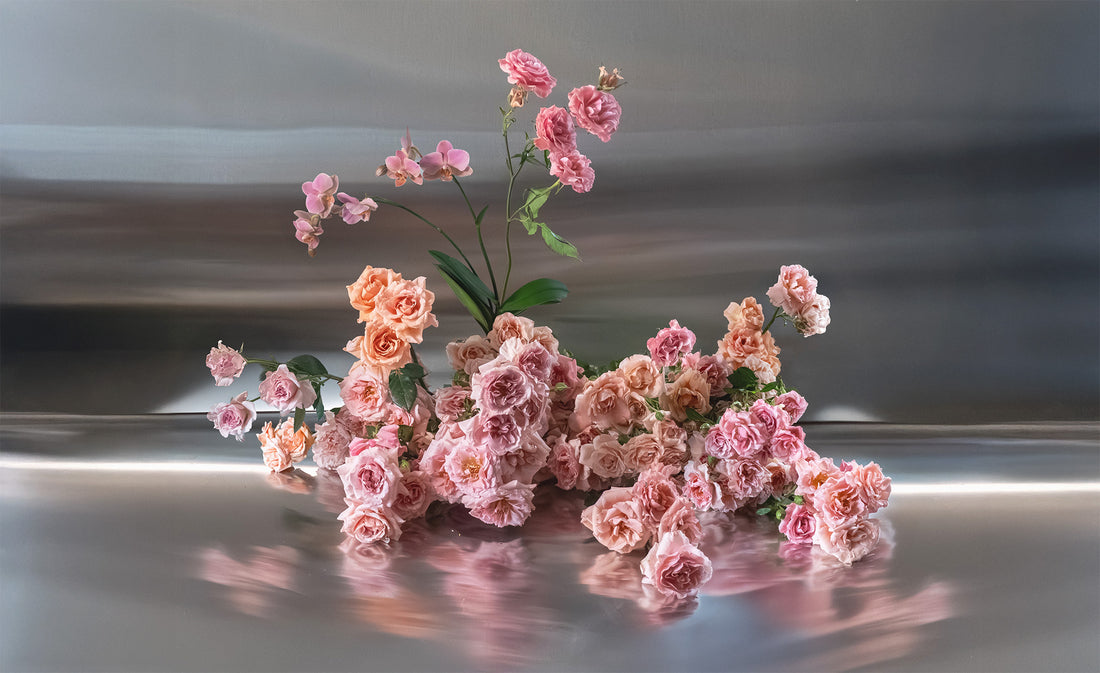 Pink roses on a reflective surface with a blurred background1