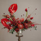 Modern floral arrangement with red anthurium, pincushion protea, and seasonal flowers by shaa.project