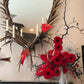 Red Noir sculptural red flower arrangement with anthuriums and dramatic branches by Shaa.Project