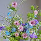 Vibrant summer morning flowers in a colorful arrangement by Shaa.Project, showcasing fresh blooms and greenery.