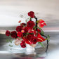 Shaa.Project Velvet Flame arrangement featuring red roses and anthurium in a stylish display.