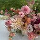Shaa.Project Sugar Bloom floral arrangement featuring vibrant flowers in a decorative vase.