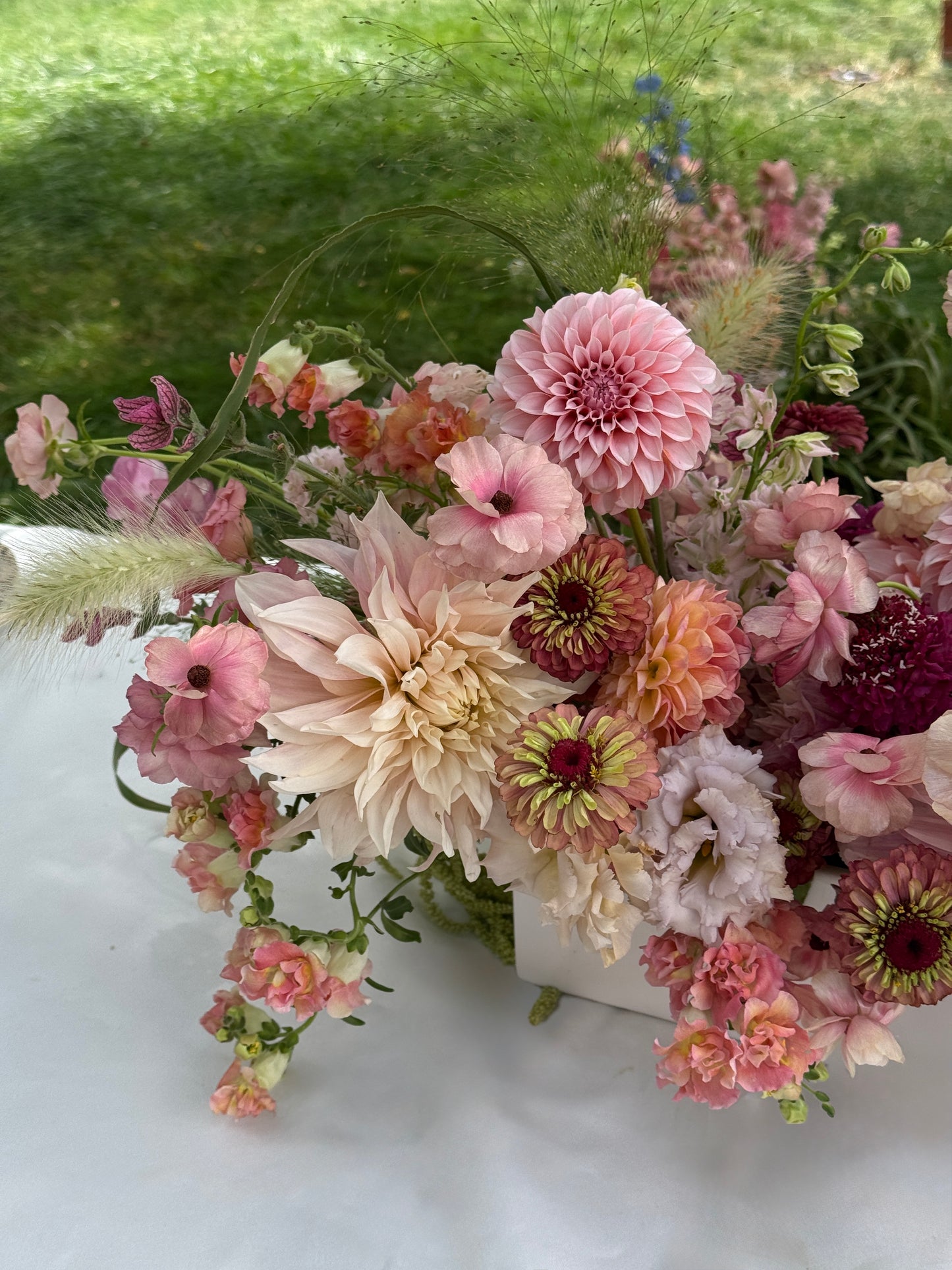 Shaa.Project Sugar Bloom floral arrangement featuring vibrant flowers in a decorative vase.