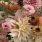Close-up of a bouquet of flowers with a focus on a large table dahlia design by the best Lakewood event florist