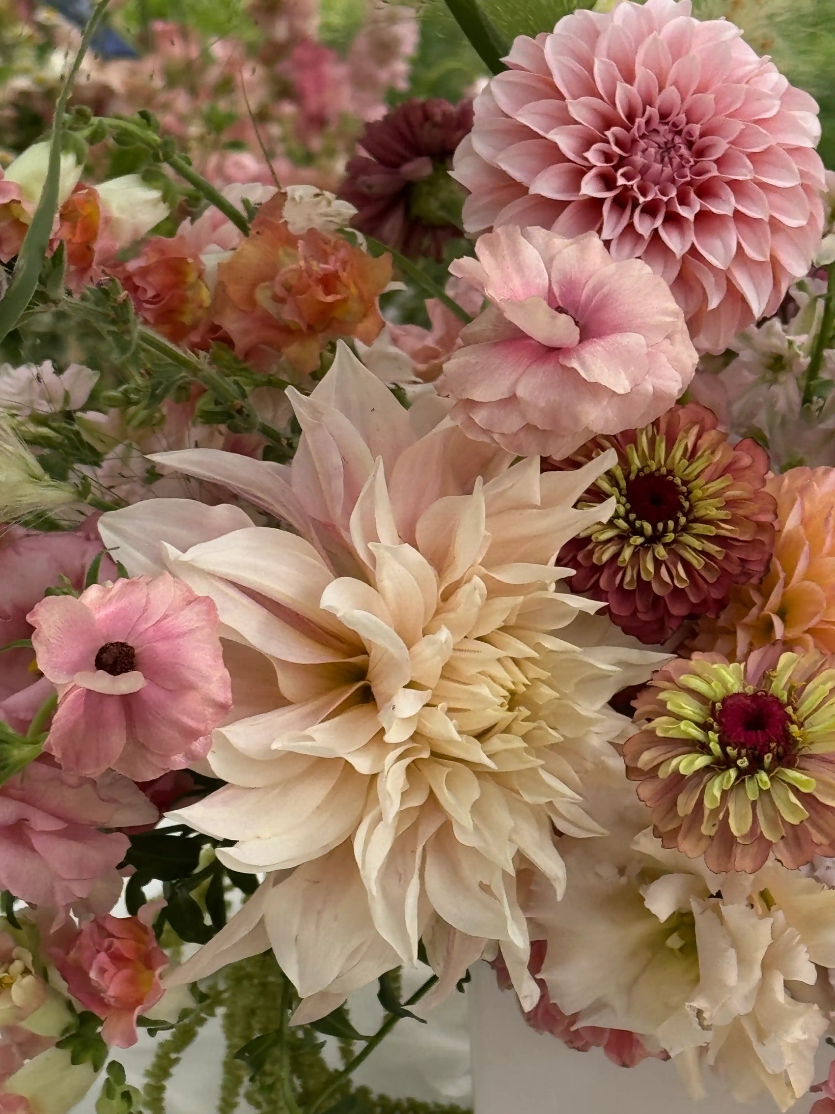 Close-up of a bouquet of flowers with a focus on a large table dahlia design by the best Lakewood event florist