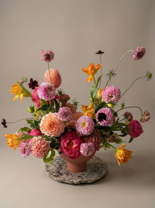 Romantic colorful flower arrangement with dahlias and tulips for anniversary celebration