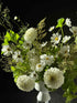 white sympathy flower arrangement with dahlias and cosmos in a ceramic vase