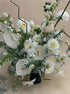 Stillness white flower arrangement with anthurium, dahlias, and layered seasonal blooms
