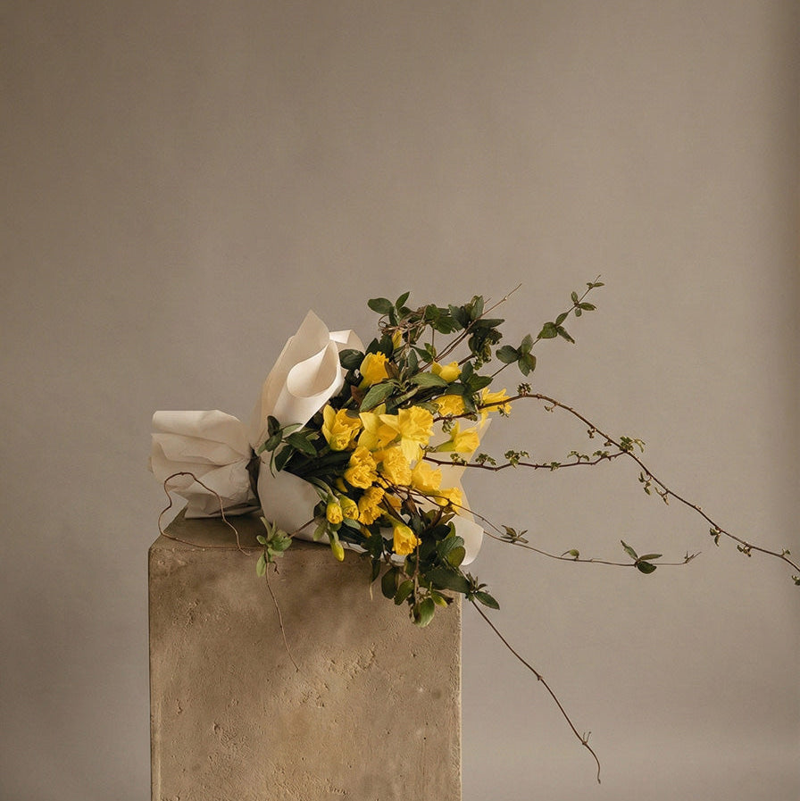 Seasonal flower bouquet with yellow blooms and natural greenery in artistic composition same-day delivery 